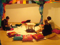 installation of tent at bonnington gallery with members of the public reading and listening to the sound work